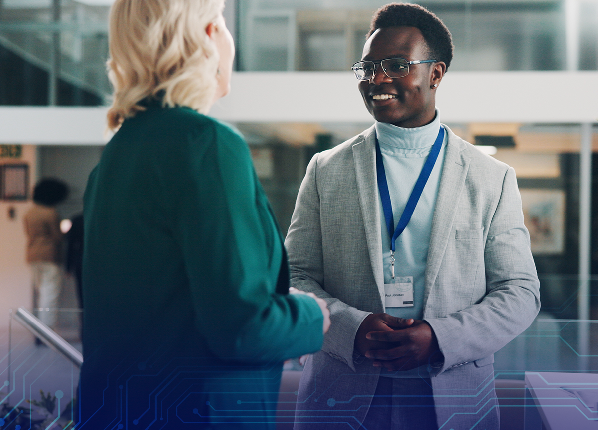 Meet Us At SCOPE 2026 with man and woman talking together.