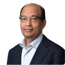 Professional headshot of Exostar's Vijay Takanti against a blank background.