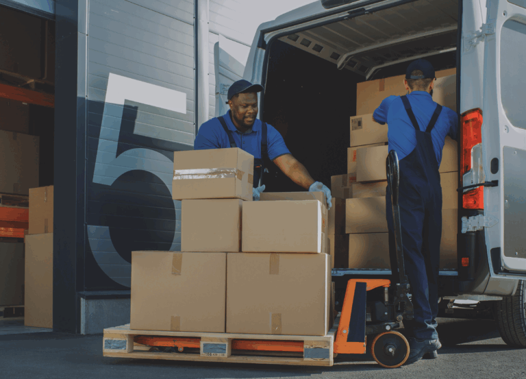 Two men unloading a van on to a pallet jack as part of a supply chain.
