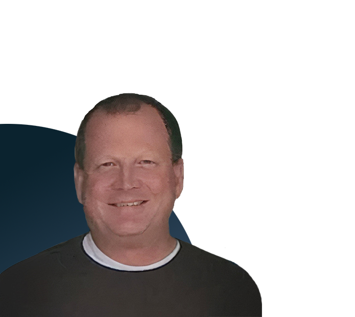 Ryan Wick from Exostar, headshot, smiling at the camera, white background.