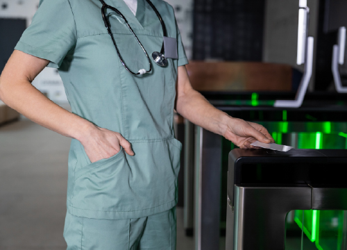 Life sciences compliance with a doctor in scrubs with stethoscope.