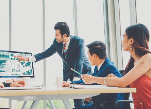 Certification image for website with three people looking at a touch screen.