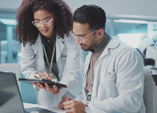 Female and male pharmacy technicians using EPCS services.