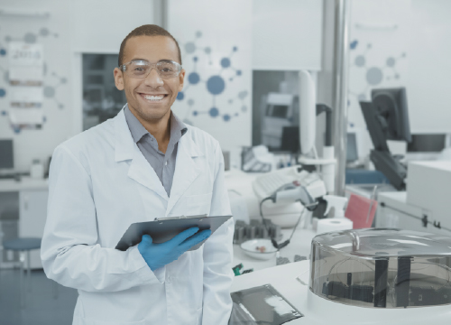 ProviderPass image of lab technician holding a clipboard smiling.